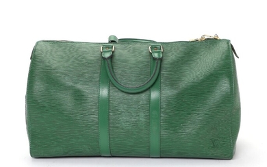 SOLD. Louis Vuitton: A "Keepall 45" travel bag made of green epi leather with gold...
