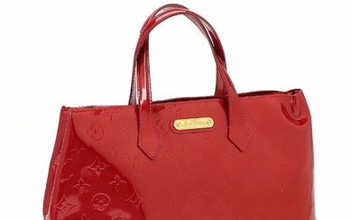 NOT SOLD. Louis Vuitton: A "Wilshire" hand bag of dark red monogram Vernis leather with...