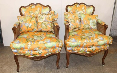 Pair of French style double cane upholstered arm chairs