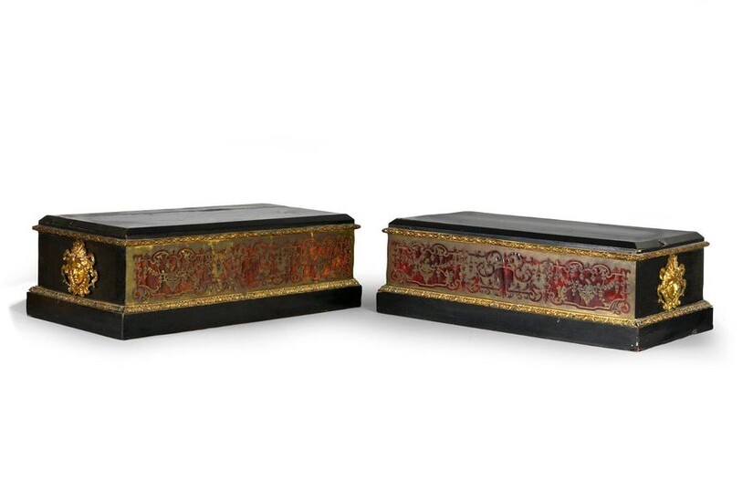 Pair of rectangular inlaid marquetry bases, with a Boulle of foliated scrolls, ebony and blackened wood veneer, decorated with a frieze of acanthus leaves and laurel, the sides adorned with chased and gilded bronze espagnolette heads.