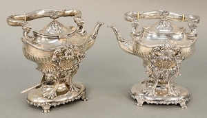 Pair of sterling silver tilting pots on stands, one
