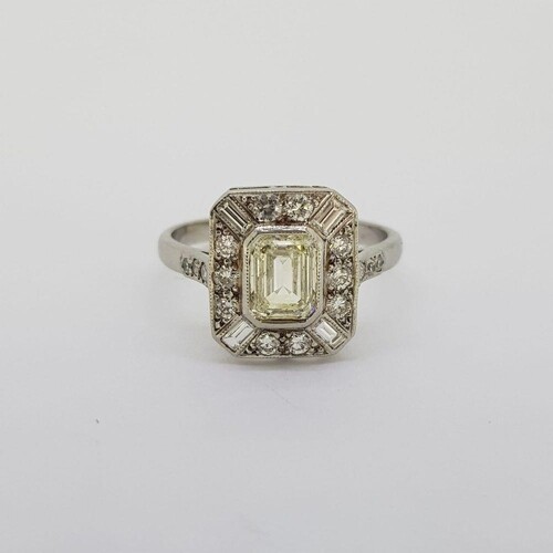Platinum tablet ring with a central Emerald cut diamond of a...