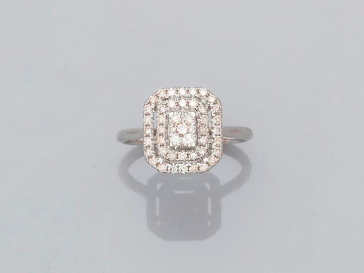Ring forming a square plate with cut sides in white gold, 750 MM, openwork, covered with diamonds, size : 54, weight : 3gr. rough.