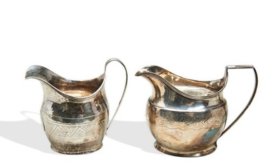 TWO GEORGE III SILVER CREAM JUGS, helmet form with bright cu...