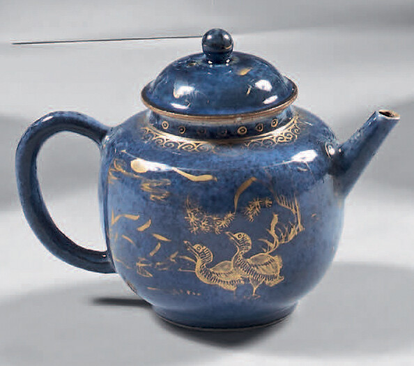 Teapot and its lid made of Chinese porcelain. 18th century. Globular in shape, with gold decoration of animals in a landscape standing out on a powdered blue background, gold wear and tear.