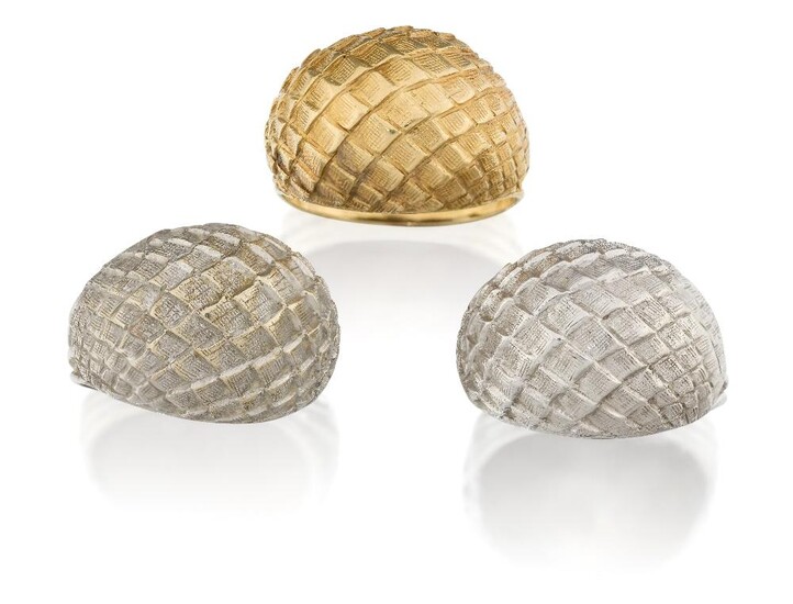 Three bombe rings, of textured design, the reeded hoops to textured domes of stylised armadillo scale design, all stamped 750, approx. ring sizes P½, Q, and T (3)