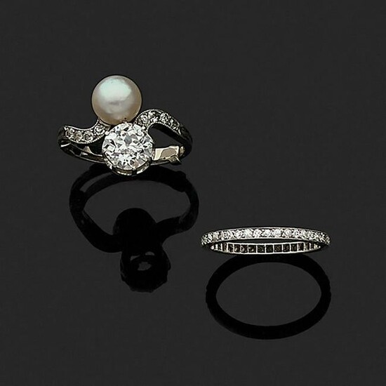 Two diamond, natural pearl and platinum rings, circa