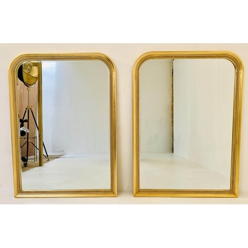 WALL MIRRORS, a pair, 110cm x 80cm, gilt frames. (2)