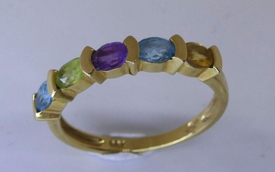 Yellow gold river ring set with fine stones: amethyst, citrine, peridot, topaz etc.. Gross weight 2,6 g