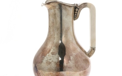 A Danish silver jug with handle of ivory. Maker Holger Rasmussen, Copenhagen 1940s. Weight 358 g. H. 17 cm.