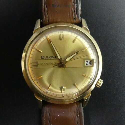 18 carat gold Bulova Accutron date adjust gents watch. 34 mm...