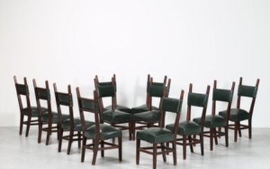 ITALIAN MANUFACTURE Twelve chairs. Wood and skai. …