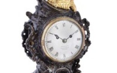 A George IV gilt and patinated bronze rococo style