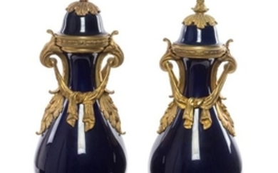 * A Pair of Sevres Style Gilt Bronze Mounted Porcelain Vases
