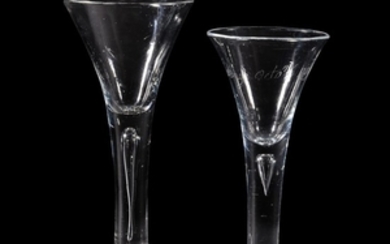 Two plain-stemmed wine glasses of drawn trumpet form