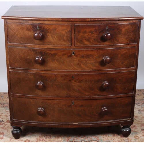 A 19TH CENTURY MAHOGANY BOWED FRONT CHEST the shaped top abo...
