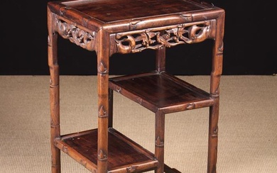 A 19th Century Chinese Carved Hardwood Stand. The rectangular top above two staggered tiers of displ