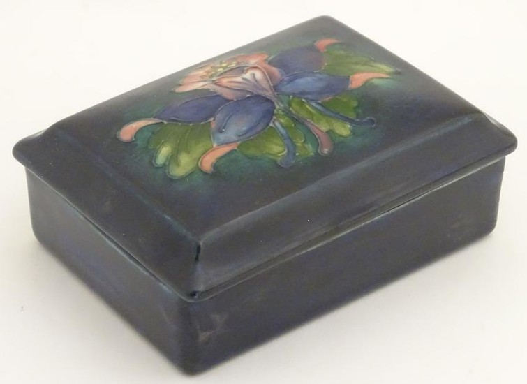 A 20thC W. Moorcroft lidded trinket box decorated with