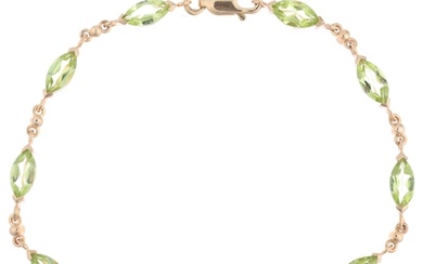 A 9ct gold peridot tennis line bracelet, set with marquise-c...