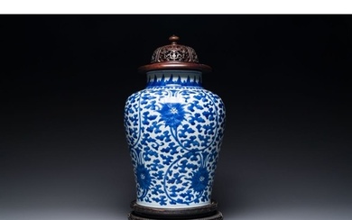 A Chinese blue and white 'lotus scroll' jar with wooden cove...