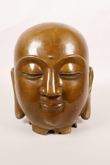 A Chinese bronze Buddha head, 8" high