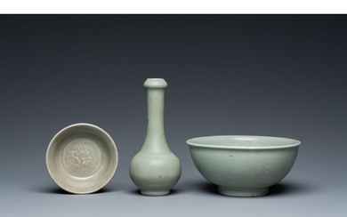 A Chinese celadon-glazed bottle vase and two bowls, Yuan/Min...