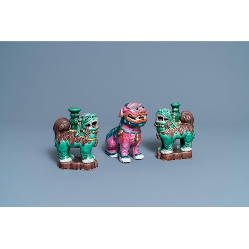 A Chinese famille rose model of a Buddhist lion and a pair o...