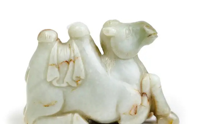 A Chinese green and mottled white jade carving of a camel 20th...