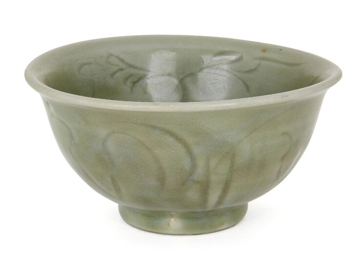 A Chinese grey stoneware Longquan celadon bowl, Ming dynasty, 15th century, incised with stylised floral motifs, red burnished firing ring to base, 15cm diameter