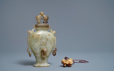 A Chinese jade 'twin fish' vase and a...