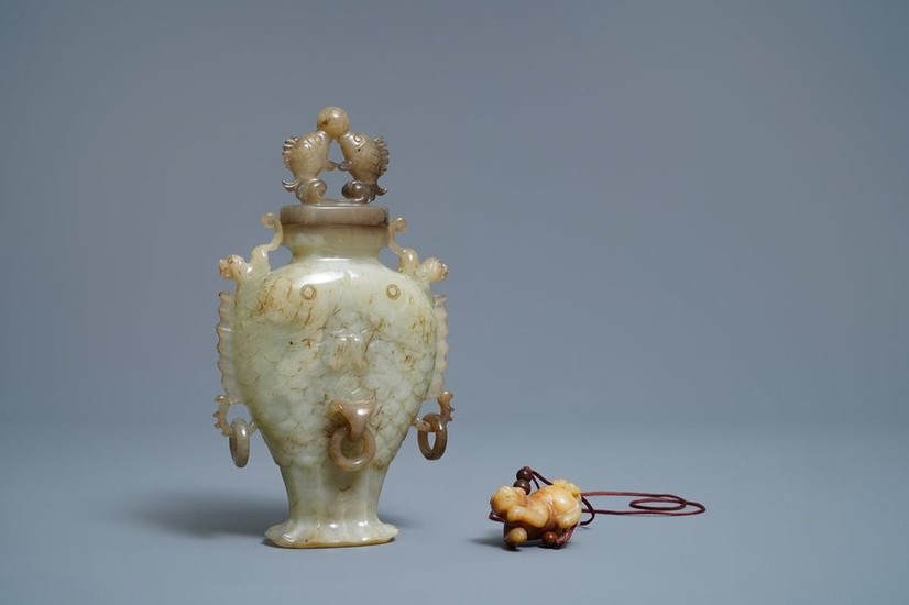 A Chinese jade 'twin fish' vase and a...