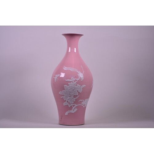 A Chinese pink ground porcelain vase with raised decoration ...