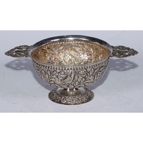 A Continental silver drinking bowl, chased with birds and sc...