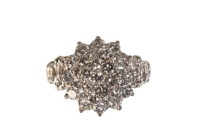 A DIAMOND COCKTAIL RING the cluster of round-cut diamonds ra...