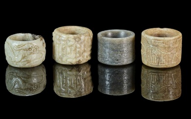 A GROUP OF FOUR CHINESE CARVED JADE ARCHERS RINGS, QING DYNASTY, 19TH CENTURY