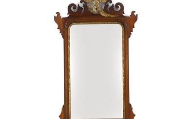 A George III style mahogany and parcel gilt fret carved mirror