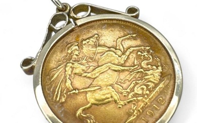 A George V full gold 1912 sovereign in a 9ct...