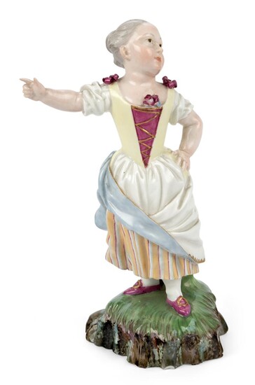 A German porcelain figure of a Bauermadchen (Peasant girl), possibly Hochst, possibly c.1770, crowned blue wheel mark, modelled as a young girl wearing a yellow and red bodice standing with her right arm pointing, on a grassy rocky mound base...
