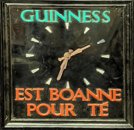 A Guinness wall clock by Smiths, Channel Island French