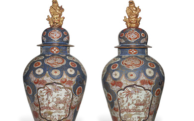A LARGE PAIR OF JAPANESE EXPORT IMARI VASES AND COVERS...