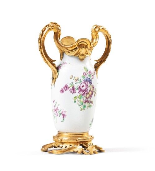 A Louis XV gilt-bronze mounted porcelain vase, the porcelain probably English, circa 1760, the mounts Louis XV, circa 1760-1770 | Vase en porcelaine probablement anglaise vers 1760 et monture de bronze doré d'époque Louis XV, vers 1760-1770