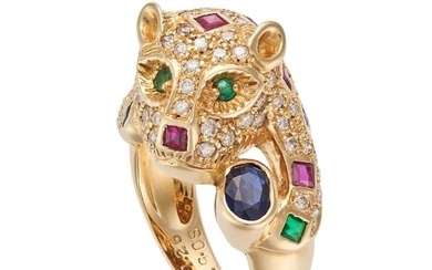 A MULTIGEM PANTHER RING designed as a coiled panther, set with square step cut rubies, emeralds a...