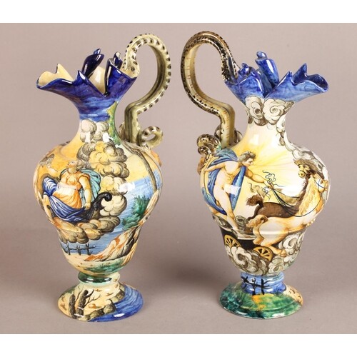 A PAIR OF LATE 19TH CENTURY CANTAGALLI FAIENCE POTTERY EWERS...