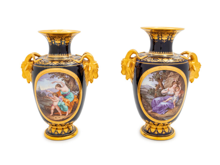 A Pair of Vienna Painted and Parcel Gilt Handled Porcelain Urns