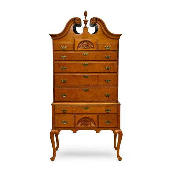 A Queen Anne carved figural maple bonnet top high chest of drawers