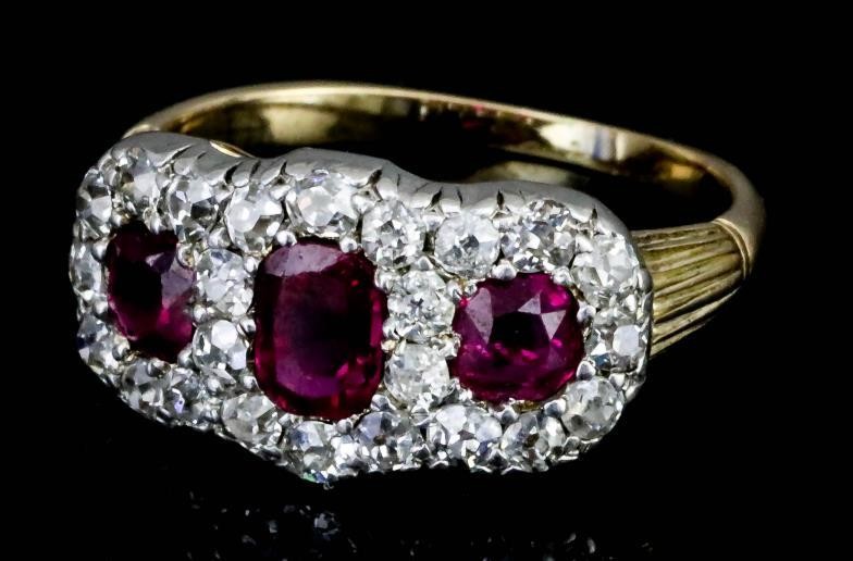 A Ruby and Diamond Cluster Ring, Modern, in gold...