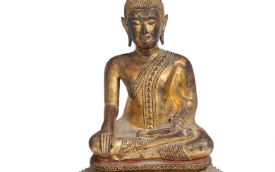 A Thai 19th century gilt and painted bronze Buddha figure seated on...