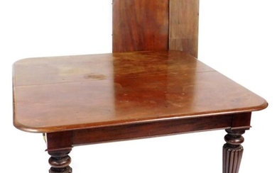 A Victorian mahogany draw leaf dining table, with one...