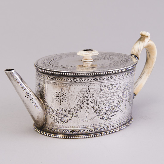 A Victorian silver teapot by Charles Boyton & Son, London 1876.