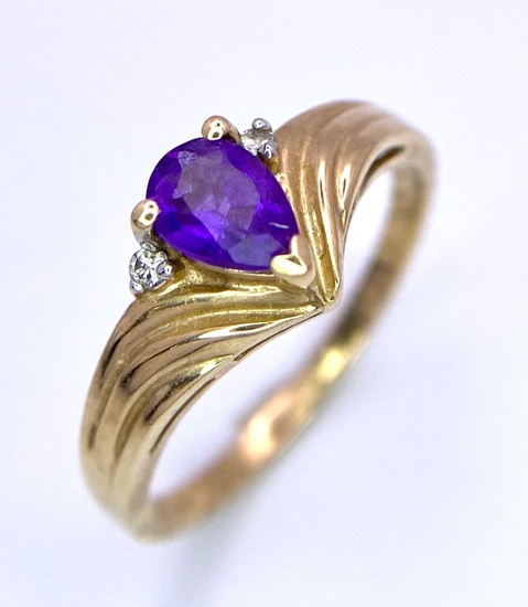 A Vintage 9K Yellow Gold Amethyst and Diamond Ring....